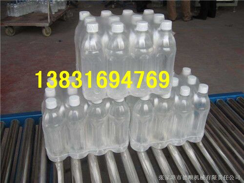 生产青岛啤酒袖口式全自动热收缩包装机厂家  袖口式包膜机  饮料水包装机