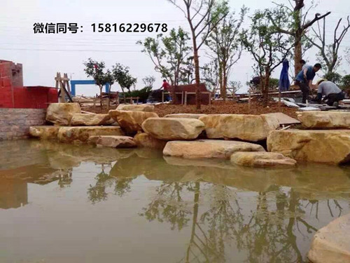 小区黄蜡石假山案例 园林造景石 广东黄蜡石批发
